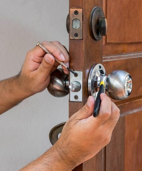 wood door and locksmith maintain silver knob